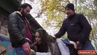 Horny foreign slut has sex in the park with two men
